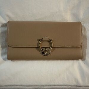 Salvatore Ferragamo Tan leather wallet.